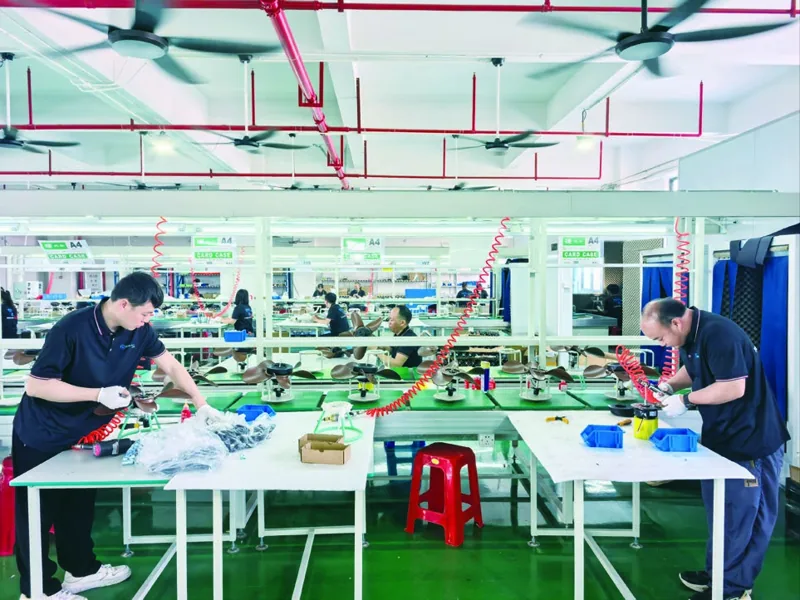 Staff working at ECO Fans assembly stations